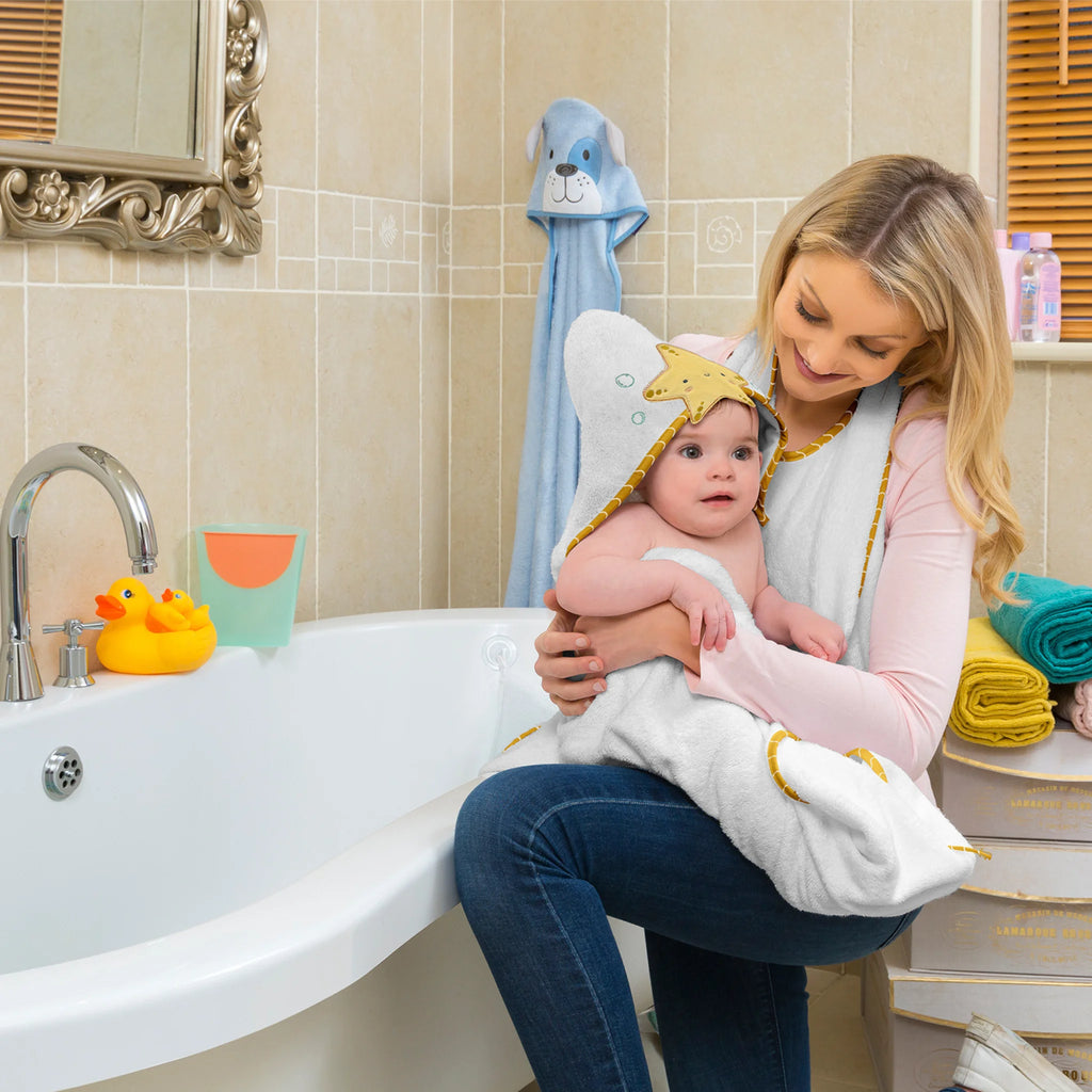 Mother drying baby after bath with ClevaMama bamboo extra large apron baby bath towel in starfish hood design, ultra-soft, absorbent, hypoallergenic and eco-friendly towel for newborns and toddlers.