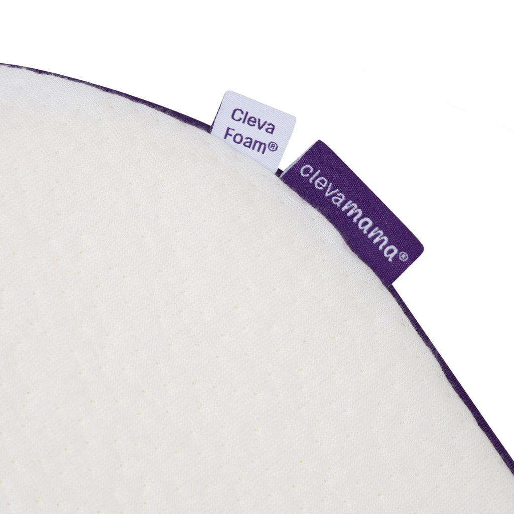 Close-up of ClevaMama ClevaFoam Elevated Baby Support Pillow with branded fabric tags, showcasing premium breathable foam material for safe, comfortable, and supportive infant sleep.