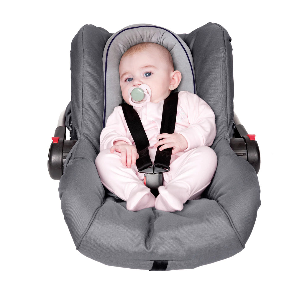 Baby seated in car seat using ClevaFoam Baby Head & Body Support V2, ergonomic infant cushion insert providing head, neck and body alignment, breathable hypoallergenic support for safe travel and flat head prevention.