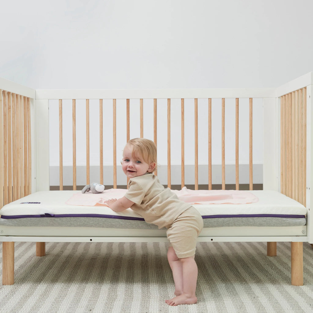 Toddler leaning on ClevaFoam Support Mattress