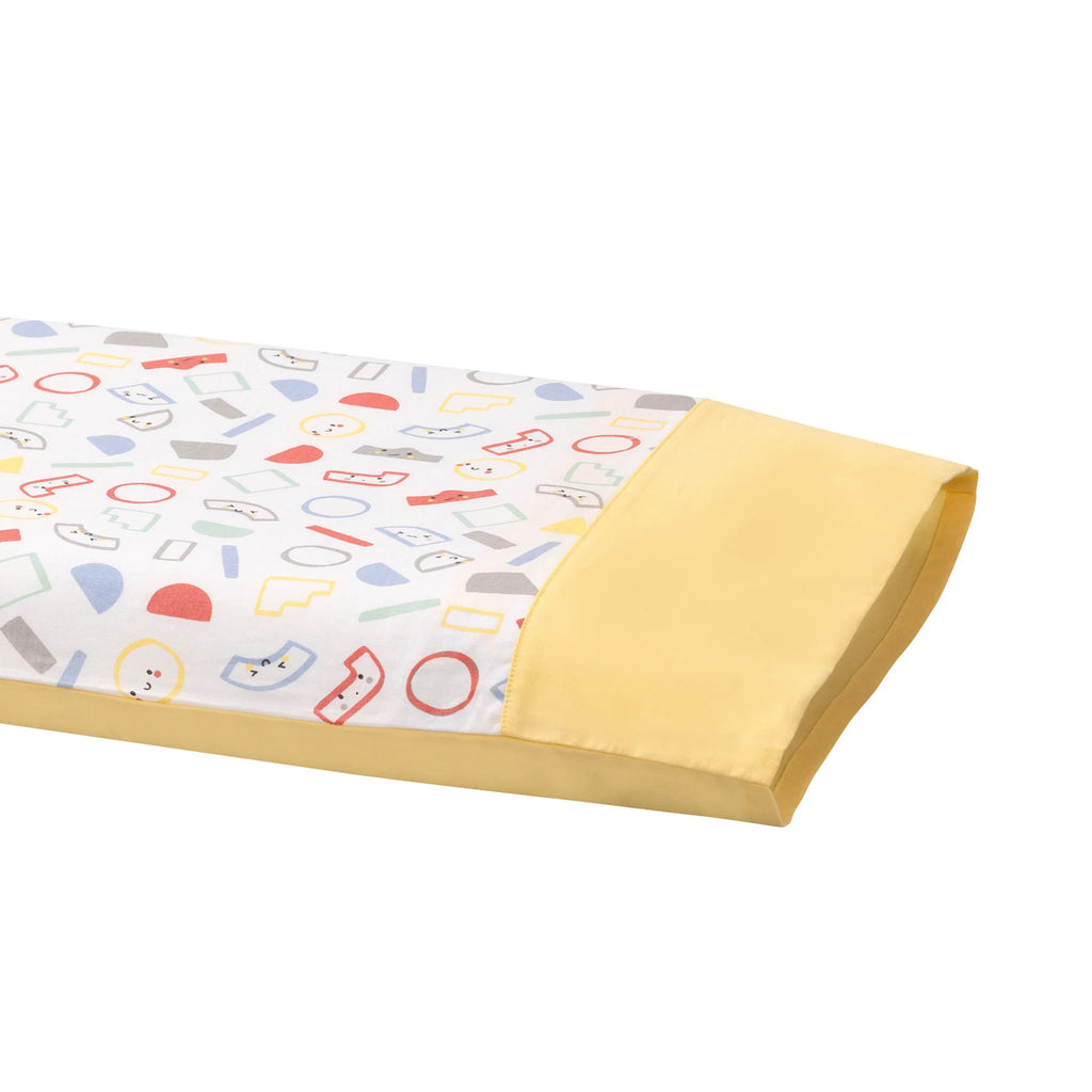 Clevamama 100% Natural Cotton Toddler Pillow Case in colorful geometric print with yellow trim, breathable hypoallergenic pillow cover designed to fit ClevaFoam Toddler Pillow 35cm x 55cm, soft and machine washable for children aged 12 months+.