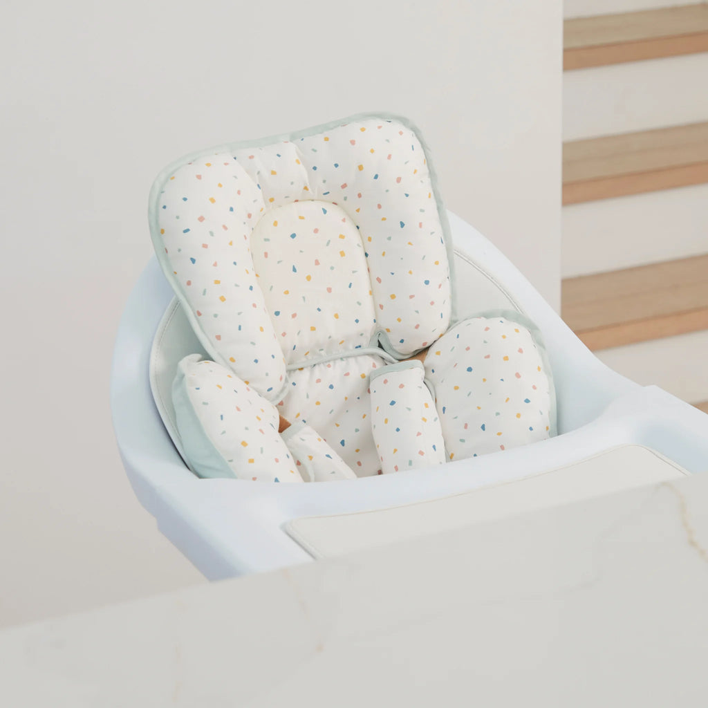 High chair with ClevaMama Head & Neck Support inserted in seat.