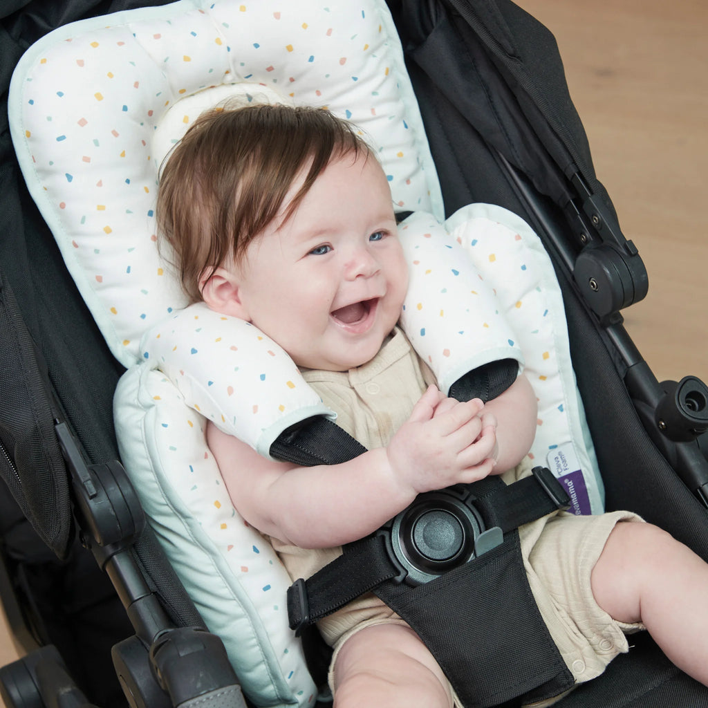 Baby in stroller with the ClevaMama Head & Neck Support.