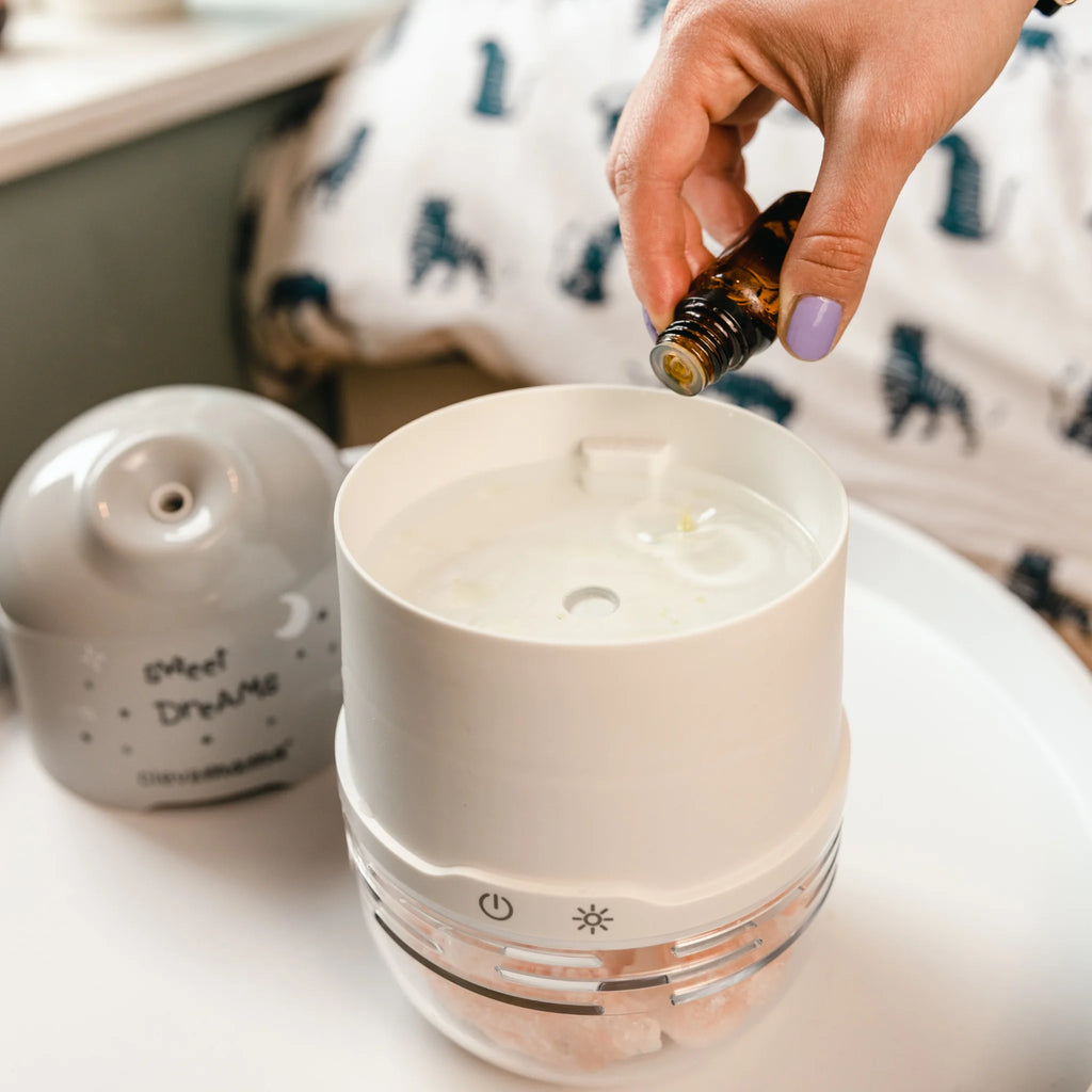ClevaPure humidifier diffuser being filled with essential oils for aromatherapy use.